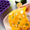 Honeycomb silicone ice tray with 37-grid hexagon ice maker cubes, perfect for fruit-infused drinks with lid.