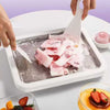 Small household yogurt frying machine for DIY ice cream rolls with spatulas, perfect for children’s frozen desserts.