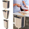 Foldable hanging trash can wall-mounted kitchen cabinet waste bin for easy food scrap disposal and space-saving storage.