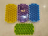 Honeycomb silicone ice tray set: 37-grid hexagon ice makers in yellow, purple, blue, and green with lids.