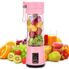 Pink portable 380ml juicer blender with 6 blades, filled with fresh fruit for smoothies on the go.