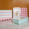 15-Grid egg storage tray, stackable refrigerator organizer with lid for space-saving kitchen egg container storage.