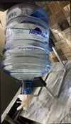 Metal stand for 19L water bottle with tap and nozzle for convenient countertop water dispensing.